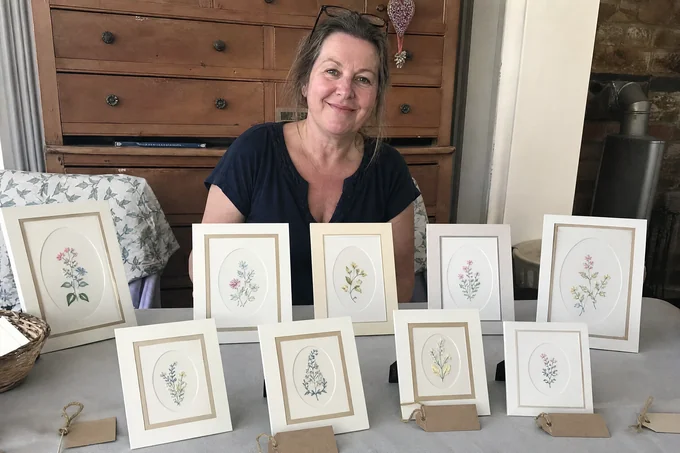 Angela T. with her finished paper-embroidery